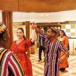 Performers and guests enjoying a vibrant dance show on the MS Esmeralda Nile Cruise, featuring traditional Egyptian attire and lively cultural performances.