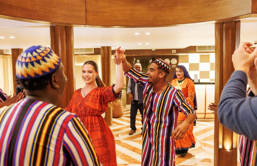 Performers and guests enjoying a vibrant dance show on the MS Esmeralda Nile Cruise, featuring traditional Egyptian attire and lively cultural performances.