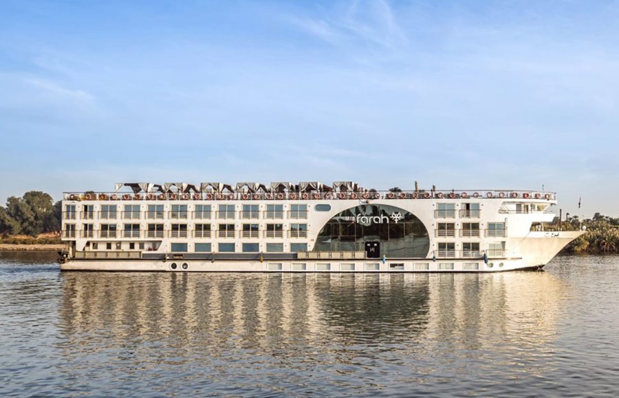 MS Farah Nile cruise ship sailing on the river, showing its distinct central arched window.