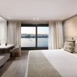 A luxurious suite on the MS Terramar with a panoramic Nile view.