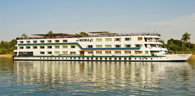 A Cruise Ship Sailing On The Calm Nile.