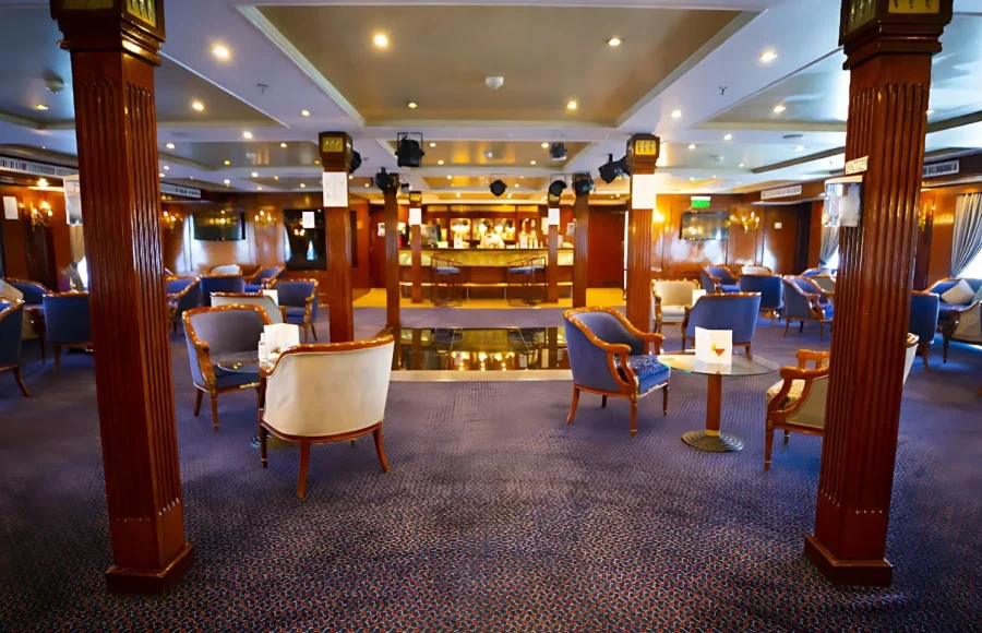 The elegant lounge and bar area, an ideal setting included in the best Cairo Nile Cruise Package.
