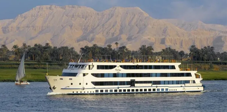 Cruise Ship Sailing With Desert Mountains.