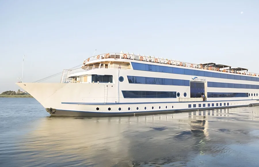 A cruise ship sails smoothly on the Nile River, a comfortable vessel for the Egypt Round Trip with Nile Cruise.