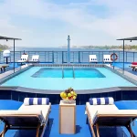 Sun deck and swimming pool on a Nile cruise ship, a highlight of a Cairo Sharm El Sheikh with Nile Cruise vacation.