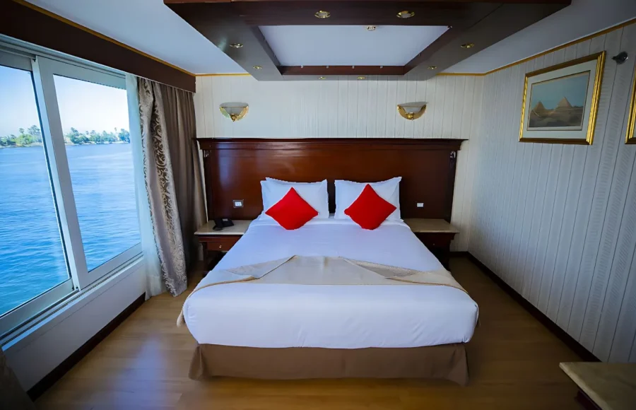 A spacious cabin and a large window with Nile view, a perfect retreat on the Best Egypt Nile Tour 10 Days.