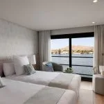 Bright and luxurious twin-bed room on the MS Soleil Nile Cruise.