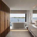 Modern and luxurious bathroom on the MS Soleil Nile Cruise, featuring a freestanding bathtub.