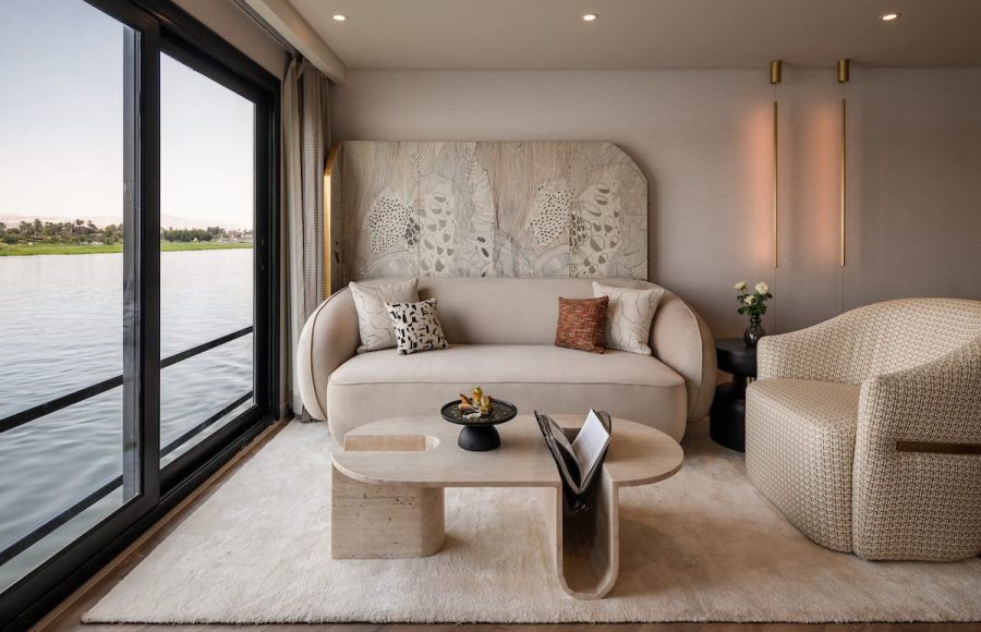 The chic living area within a suite on the MS Soleil Nile Cruise overlooking the Nile River.