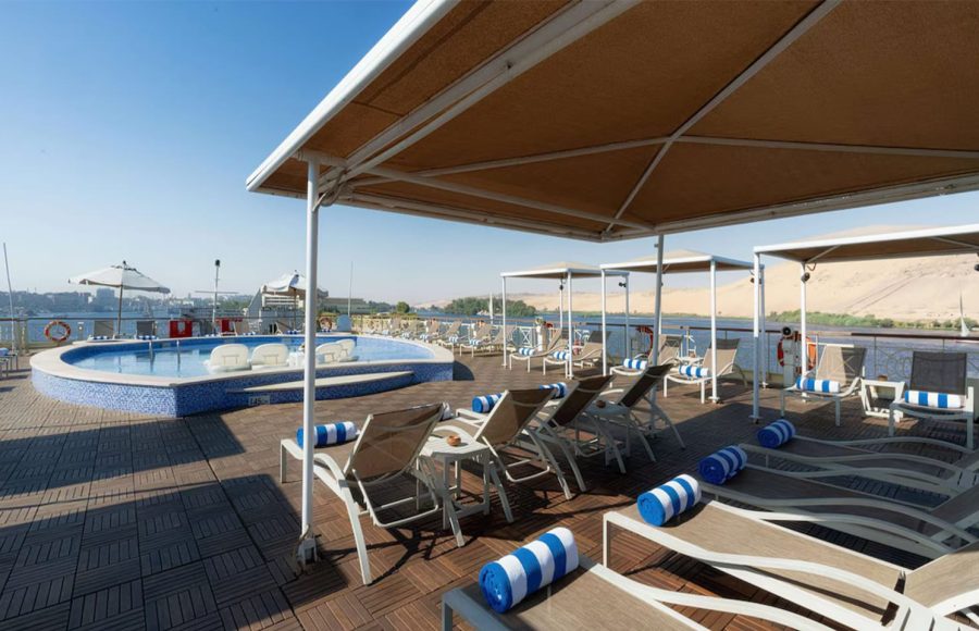Sun deck with pool, loungers, and canopies on a Nile cruise ship.