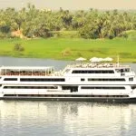 A luxury Nile cruise ship, the MS Alexander The Great, sailing on the river.